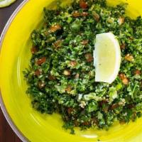 Tabbouli · A traditional Mediterranean salad made with finely chopped parsley, tomato, onion, lettuce, ...