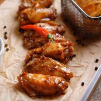 8 Pieces Spicy Chicken Wings · 8 Pieces of Perfectly baked, crispy chicken wings, with an added kick spicy seasoning. Serve...
