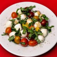Insalata Caprese · Slices of fresh mozzarella cheese, slices of roma tomatoes, fresh basil, pepper and extra vi...