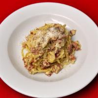 Linguine Squarciarella - Gino'S Favorite · Linguine pasta with stirred egg, prosciutto, onion, parmigiano, and black pepper.