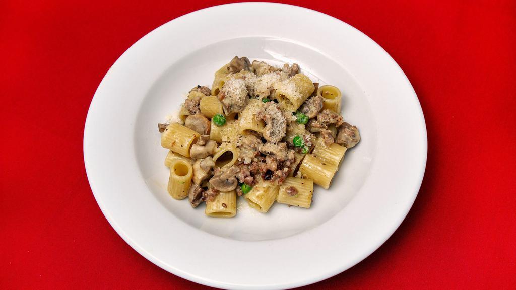 La Burina · Rigatoni pasta with crumbled Italian salsiccia, green peas, mushrooms, and cream.