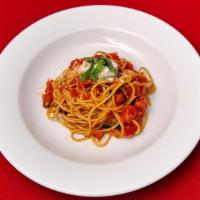 Spaghetti Al Pomodoro · Spaghetti tossed with fresh tomatoes, topped with parmigiano cheese and fresh basil.