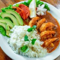 Camarones Al Mojo De Ajo · Prawns marinated in lime, chili and garlic. Served with rice.