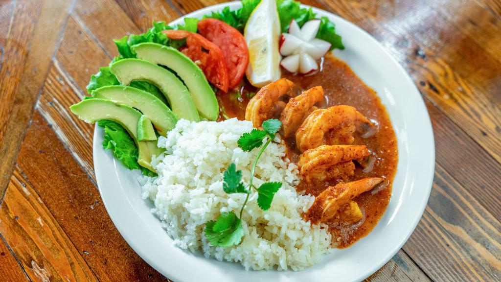 Camarones Al Mojo De Ajo · Prawns marinated in lime, chili and garlic. Served with rice.