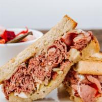 The Pastrami · House Smoked Wagyu Beef Pastrami, 1000 Island Dressing, House Caraway Kraut & Melted Swiss o...