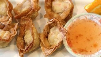 Crab Delight  · Crab meat mixed with cream cheese and wrapped in wonton sheets, Deep-fried, then served with...