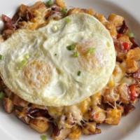 Southern Comfort · Our hash base with diced jalapeno, fire roasted corn, breakfast sausage, pimento cheese and ...