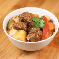 Beef Mechado · Filipino-style beef stew with potatoes, carrots, bell peppers and spices.