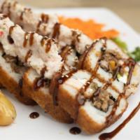 Sushinola Roll · Filled with seaweed, cucumber, avocado, cream cheese, beef, shrimp and bacon. Outside crab s...