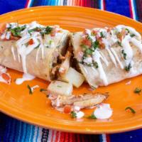 Breakfast Burrito · Two eggs scrambled with potatoes and you choice of carne asada, verde chicken or grilled faj...