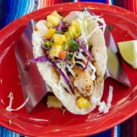 Fish Taco · Garlic grilled mahi with cabbage and fruit salsa.
