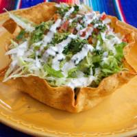 Taco Salad · Meat, beans, iceberg lettuce, guacamole, sour cream + pico.