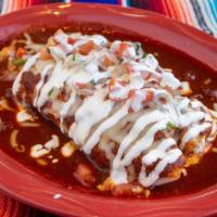 Tamale · Grandma's recipe chicken tamale, red or green sauce, cheese, sour cream and pico.