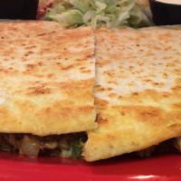 Steak Quesadilla · Thin strips of steak grilled with jalapeños onions and tomatoes tucked inside a lightly toas...