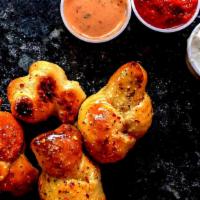 Garlic Knots · Four to an order, choose dipping sauce. Vegan Friendly