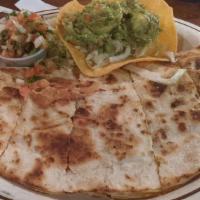 Carne Asada · A larger flour tortilla filled with cheddar & monterrey jack cheese grilled & served with gu...