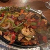 Shrimp, Steak, Chicken · Marinated Steak, Chicken, and Shrimp grilled with onions and bell peppers. Served with beans...