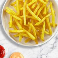 In Fries We Trust · Idaho potato fries cooked until golden brown and garnished with salt.