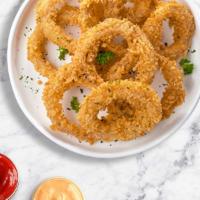 Lord Of The Onion Rings · Sliced onions dipped in a light batter and fried until crispy and golden brown.