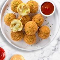 Wrecking Mac & Cheese Ball · Bite-size clumps of cavatappi and vegan Pepper Jack cheese breaded and fried until golden br...