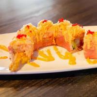 Hq Roll · Golden brown shrimp, HQ signature sauce, cucumber, seaweed paper--topped with lobster salad,...