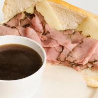 French Dip & Swiss · Thinly Sliced Beef, Aged Swiss Cheese, Toasted French Roll, Served with Au jus.