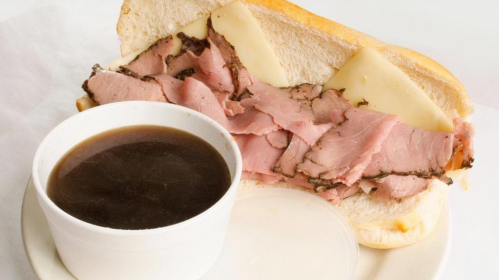 French Dip & Swiss · Thinly Sliced Beef, Aged Swiss Cheese, Toasted French Roll, Served with Au jus.