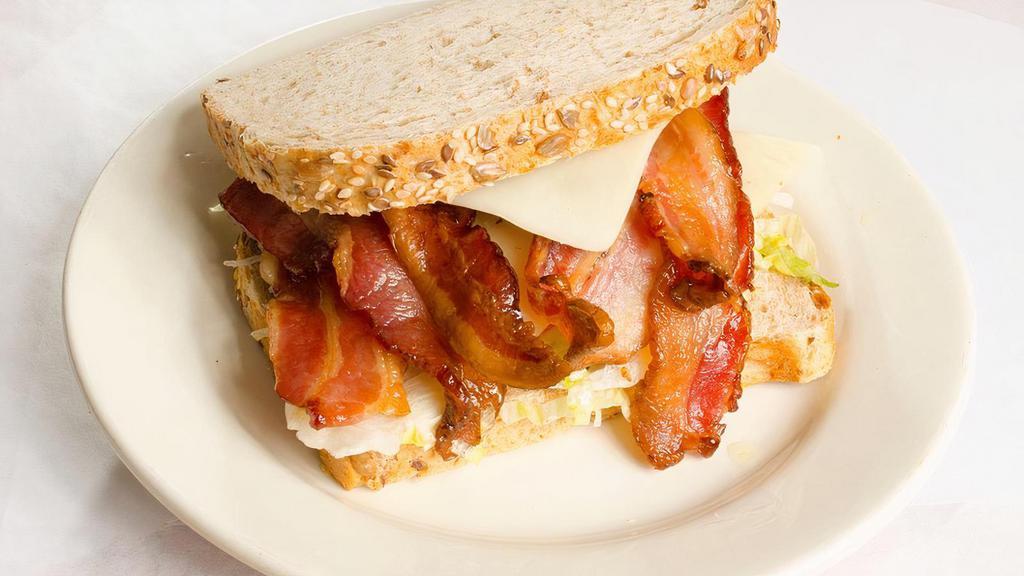L.T. · Thick Crispy Bacon, Served on with Lettuce, Tomatoes, Swiss Cheese, and Mayo.
Served on Whole Wheat Toasted Bread.
