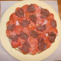 Cardiac Carnivore · Mozzarella, Italian sausage, salami, canadian bacon, pepperoni & 90% lean fresh beef.