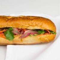 Banh Mi Thit Nuong · Foot long sandwich with grilled pork.