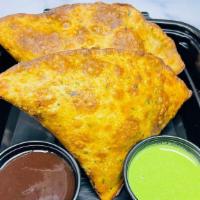 Vegetable Samosa (Vegan) · Mashed potatoes, peas and spices filled in a pastry and crisp fried served with tamarind sau...