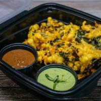 Kale Pakoras · Desi style savory kale fritters made with chickpea batter, serves with green chutney and tam...