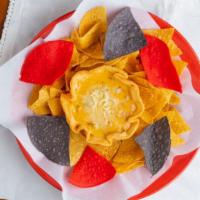 Chile Con Queso · Our famous green chile recipe blended with assorted cheeses and aged cheddar cheese.