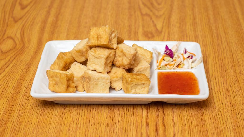 Golden Tofu · Gluten free. Deep fried golden brown tofu serve with plum sauce with ground peanut.