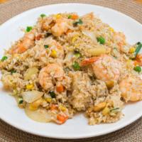 Pineapple Fried Rice · Gluten free. Stir-fried rice with peas, carrots, white onion, green onion, pineapple, cashew...