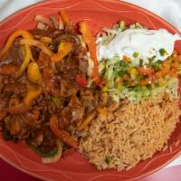 Enchiladas Rancheras · 2 cheese enchiladas topped with pork tips, grilled vegetables and ranchero sauce served with...