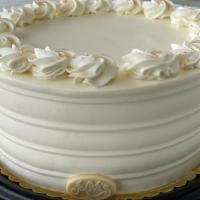 Carrot Torte · Carrot cake with raisins and walnuts and cream cheese filling. Iced in vanilla Swiss butter ...