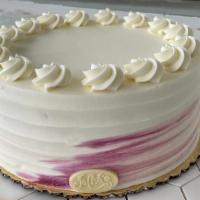 White Raspberry Torte · White lovelight cake with raspberry preserve filling. Iced in vanilla Swiss butter cream.
