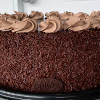 Fudge Torte · Chocolate fudge cake with fudge filling. Iced in a chocolate Swiss butter cream and poured i...