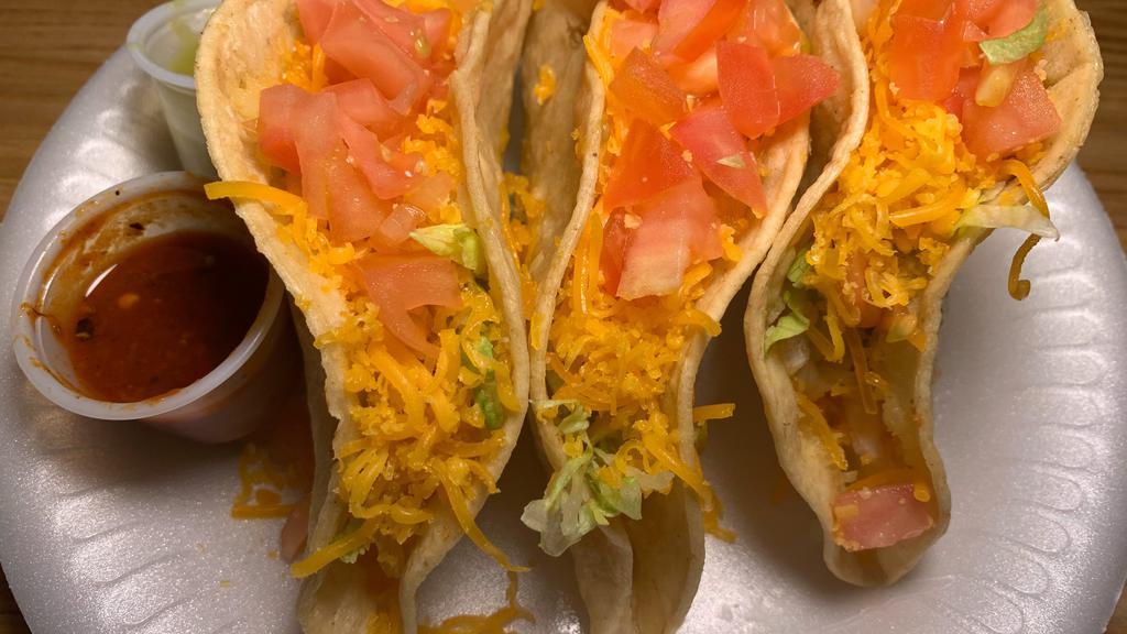 3 Hard Shell Chicken Tacos W/Rice And Beans Plate · 3 Crunchy chicken tacos with cheese lettuce and tomato. Includes rice, beans and sour cream.
