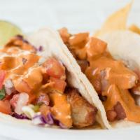 Baja Fish Tacos · Deep fried tilapia, cabbage, pico de gallo, mayo, mexican crema, chipotle salsa (spicy). Cor...