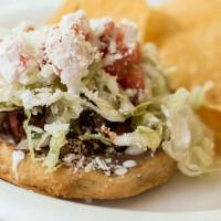 Sopes · Choice of meat, beans, lettuce, tomato, onions, cilantro, salsa, Mexican crema & Cotija chee...
