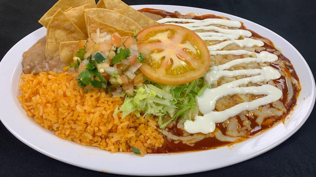 2 Enchiladas W/Rice & Beans · Chicken, carne asada, cheese, rice, beans, lettuce, tomato, sour cream and chips
