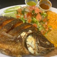 Mojarra W/ Rice & Beans Plate · Deep fried Tilapia Fish, served with rice, beans & Tortillas