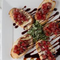 Bruschetta · Toasted Tuscan bread topped with brie, tomatoes, garlic, extra virgin olive oil, balsamic gl...