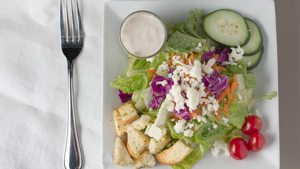 Garden Salad · Iceberg and romaine, shredded carrots, cabbage, croutons, cucumbers, grape tomatoes, mozzarella cheese and your choice of dressing.