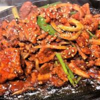 Spicy Pork Bulgogi · Korea's signature spicy pork BBQ stir fry served with rice and salad
