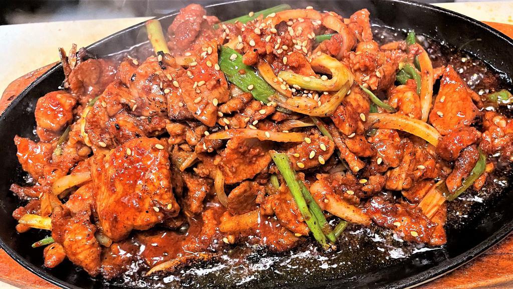 Spicy Pork Bulgogi · Korea's signature spicy pork BBQ stir fry served with rice and salad