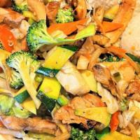 Veggie Chicken · Marinated chicken, broccoli, onion, carrot, zucchini, cabbage served with two scoops of rice