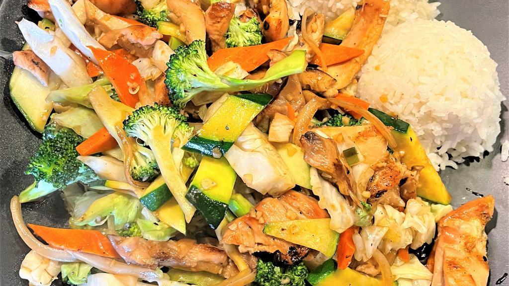 Veggie Chicken · Marinated chicken, broccoli, onion, carrot, zucchini, cabbage served with two scoops of rice